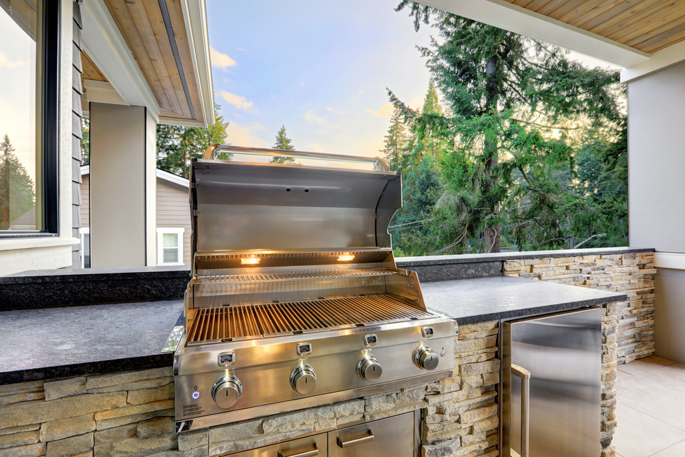 A grill with lights inside installed by an outdoor kitchen contractor.