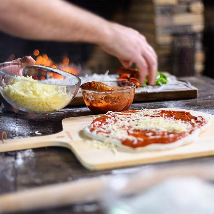 Preparation for outdoor pizza making with a kamado joe grill