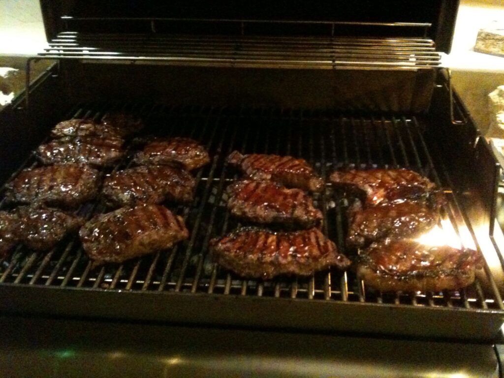 ribeye steaks on a gas grill